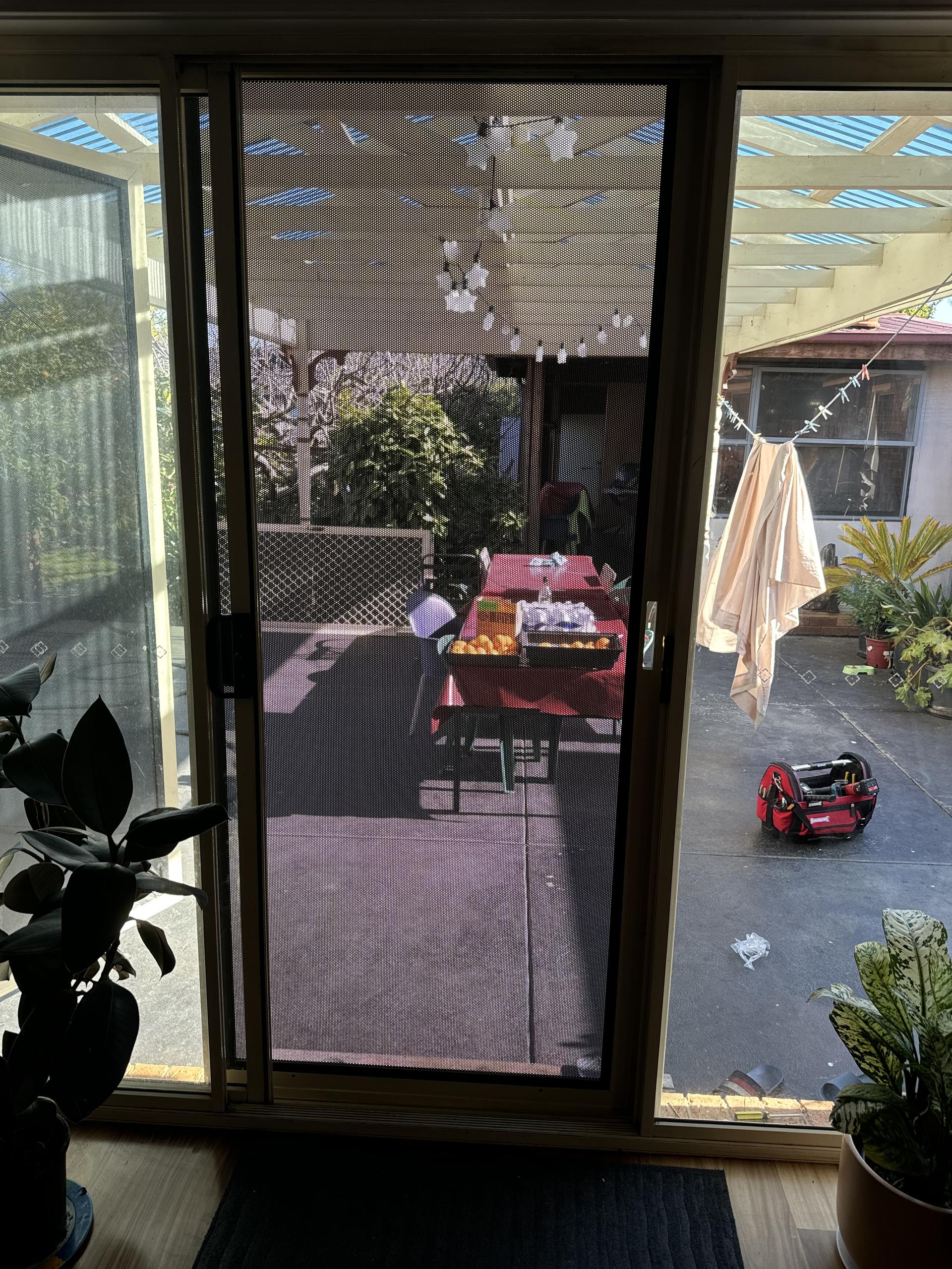 Sliding flydoor installed in a modern living room